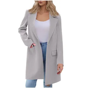 Detailed view of light gray mid-length women's coat with lapel and button closure.