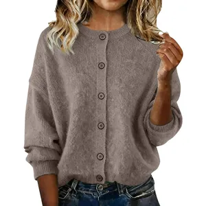 Detail showing the soft knitted texture and button closure of this brown women's cardigan