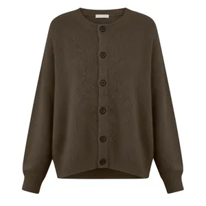 Close-up of a women's brown knitted button-down cardigan with a soft wool texture