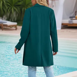 Elegant back view of women's teal mid-length blazer jacket in professional outdoor resort setting