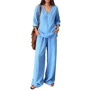 Elegante set due pezzi azzurro, top ampio a maniche lunghe con scollo a V e pantaloni