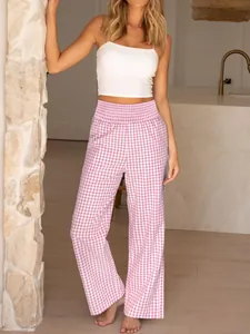 Full-length lifestyle shot of pink gingham high-waisted wide-leg trousers on a model