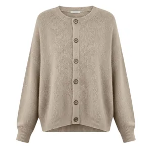 Detailed view of women's beige knit cardigan with soft texture and buttons