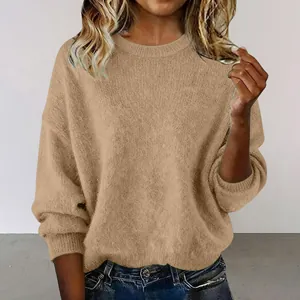 Close-up detail of a soft beige crew neck loose knit vintage style sweater for women