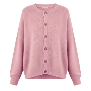 Detailed view of a pink knitted women's cardigan with soft wool texture and buttons
