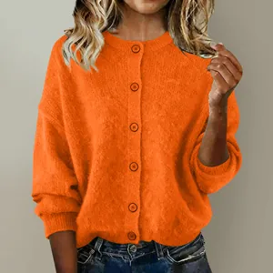 Close-up of a women's bright orange button-down knit cardigan for autumn and winter.