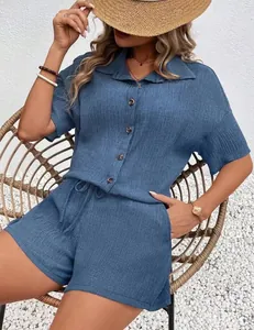 Detail view of blue waffle knit two-piece summer set with texture and buttons
