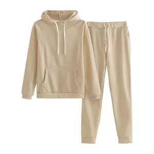 Detailed look at the soft beige two-piece tracksuit with hoodie and drawstring pants