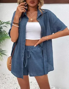 Detailed view of the blue textured cotton linen button-up shirt and shorts casual set