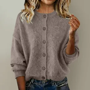Close-up of brown textured knit cardigan with button-down front and ribbed cuffs
