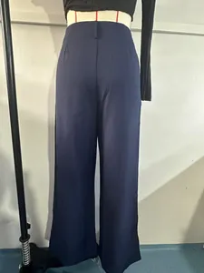 Rear view of elegant navy blue high-waisted straight-leg suit trousers on mannequin