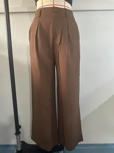 Elegant high-waist brown straight-leg dress pants for women, casual suit trousers detail.