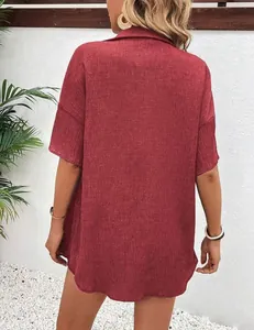 Back view of a loose dark red textured short sleeve shirt showing premium fabric detail