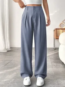 Front view detail of elegant high-waisted straight-leg suit trousers in a soft blue finish.