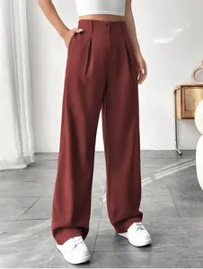 Close-up detail of elegant rust red high-waisted wide-leg trousers for professional wear