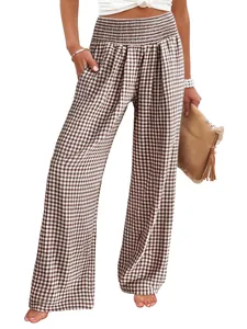 High-waisted brown gingham wide-leg pants with elastic smocked waist and side pockets