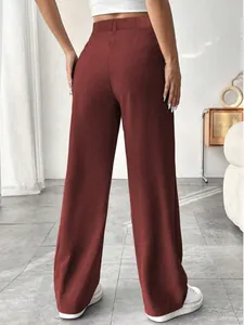 Back view of elegant high-waisted straight-leg trousers in a stylish brick red finish