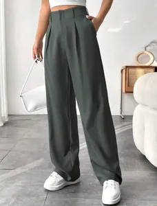 Detailed view of elegant high-waisted straight-leg trousers in olive green with front pleats