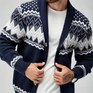 Close-up of navy blue men's cardigan with geometric star and zigzag knit patterns.