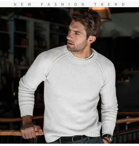Close-up detail of a men's classic light grey raglan sleeve knit pullover sweater