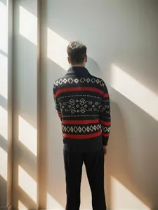 Detailed back view of men's knit cardigan with red stripes and ethnic geometric patterns