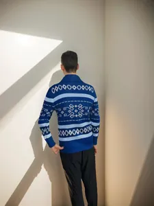 Back view of premium men's slim fit blue knit cardigan with white geometric patterns
