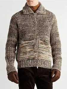 Macro view showing the thick texture of men's chunky knit zip-up cardigan in earth tones