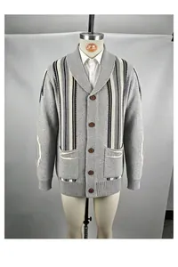 Detail view of a men's vintage shawl collar striped knit cardigan sweater in grey