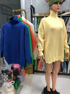 Oversized turtleneck knitted sweater for women in multiple colors shown on mannequin
