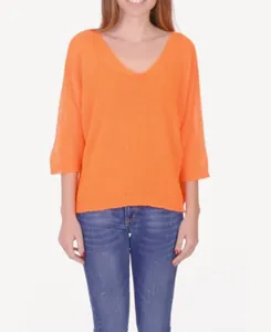 Detail view of women's loose V-neck knit sweater with 3/4 sleeves in vibrant orange