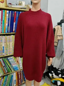 Detailed view of French retro maroon knitted long-sleeved sweater dress on a mannequin