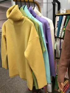 Detailed display of vibrant high neck turtleneck knitted sweaters in various colors