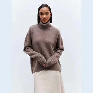 Close-up detail of a soft brown turtleneck pullover sweater showing its knit texture