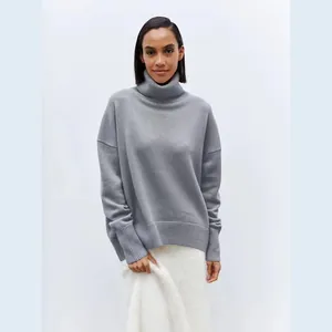 Close-up of a soft grey turtleneck sweater featuring a comfortable oversized knit design