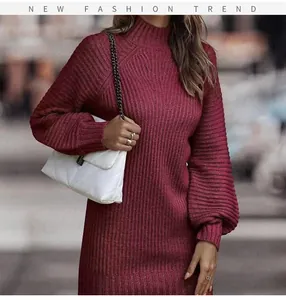 Detail shot of the burgundy high-neck ribbed knit maxi dress with elegant lantern sleeves