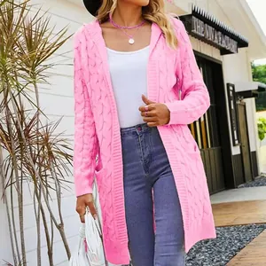 Close-up of pink cable knit hooded cardigan showing the intricate woven texture