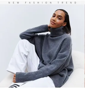 Close-up of a grey turtleneck sweater showcasing soft knit texture and rib-knit cuffs