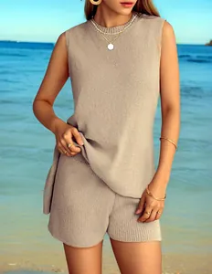 Close-up of woman wearing a chic beige sleeveless knit top and matching shorts set at beach