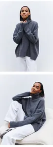 Professional detailed views of a soft grey oversized turtleneck knit sweater on a female model