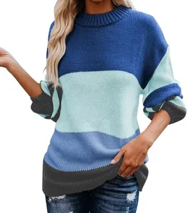 Detailed view of women's oversized color-block knit sweater with blue and grey stripes.