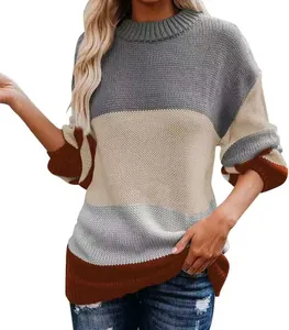 Close-up view of women's color-block patchwork knit sweater with ribbed round neck
