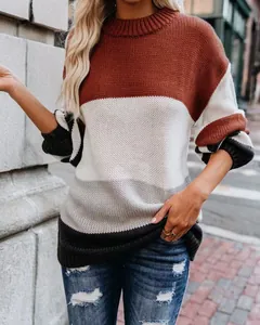 Detail of women's oversized color-block striped crew neck knitted sweater for autumn winter