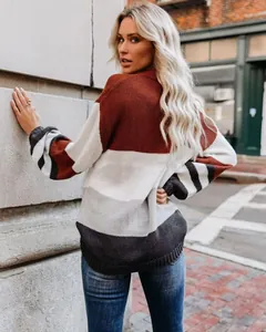 Back view of a chic color-block striped knitted sweater for women in street setting