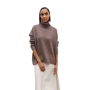 Soft and comfortable brown oversized turtleneck knit sweater for women on white background