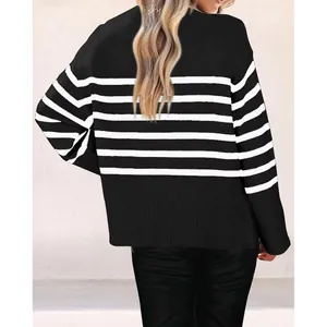 Back view detail of a chic black and white striped oversized knit sweater for stylish women