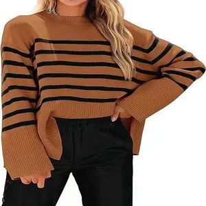 Brown and black striped loose knit sweater with wide sleeves and crew neck detail.