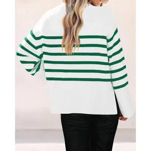 Detailed back view of a white and green striped oversized knit sweater with a side slit.