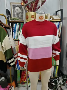 Oversized women's crewneck knit sweater featuring bold red, white, and pink stripes
