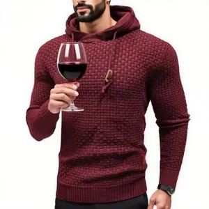 Close-up of wine red knitted hoodie featuring a textured waffle pattern and slim fit design