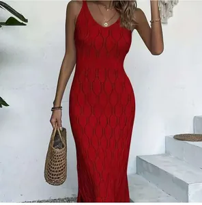 Full-length view of a red sleeveless knitted hollow-out beach dress on a model